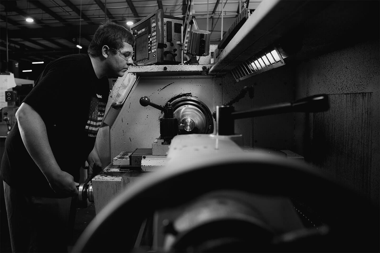 Black and white image of a machinist